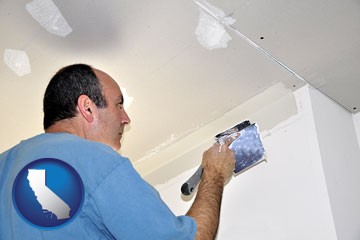 a contractor spackling drywall - with California icon