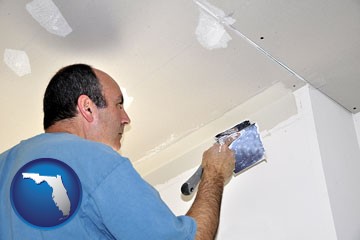 a contractor spackling drywall - with Florida icon
