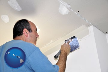a contractor spackling drywall - with Hawaii icon