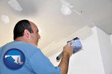 a contractor spackling drywall - with Maryland icon