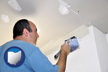 a contractor spackling drywall - with Ohio icon