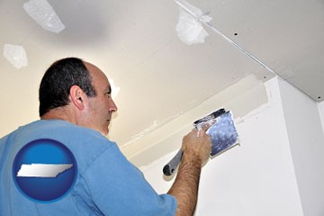 a contractor spackling drywall - with Tennessee icon
