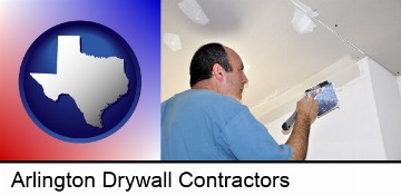 a contractor spackling drywall in Arlington, TX