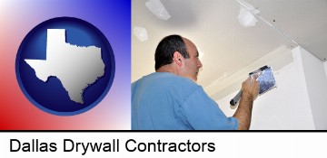 a contractor spackling drywall in Dallas, TX