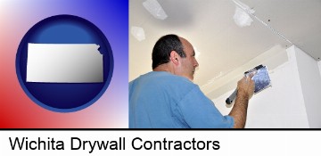 a contractor spackling drywall in Wichita, KS